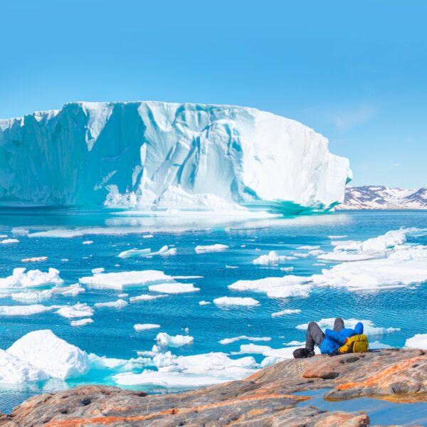 Environmental,Concept, ,A,Man,Hiker,Looking,At,Melting,Glacier
